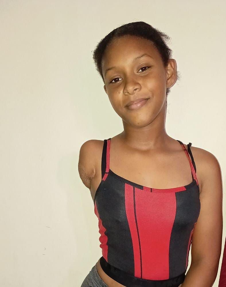 A young girl smiling for a portrait