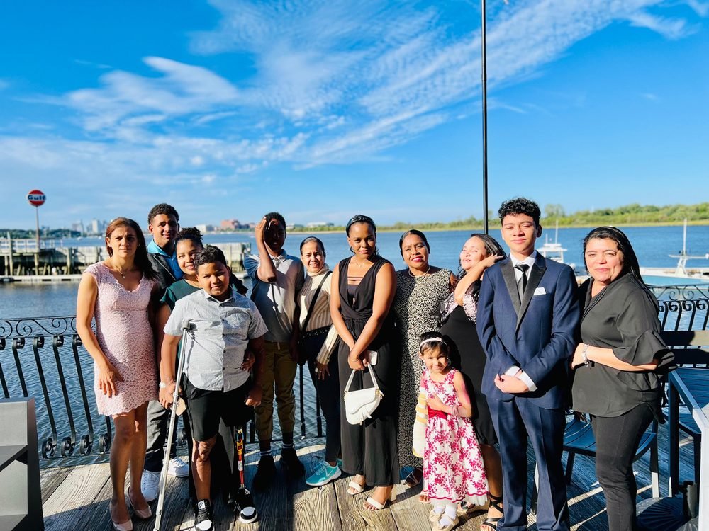 Families and friends dressed up for a celebration by the Boston waterfront